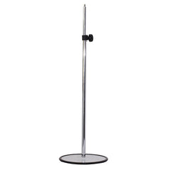 chrome  body form with round base stand for stylish clothing exhibitions.
